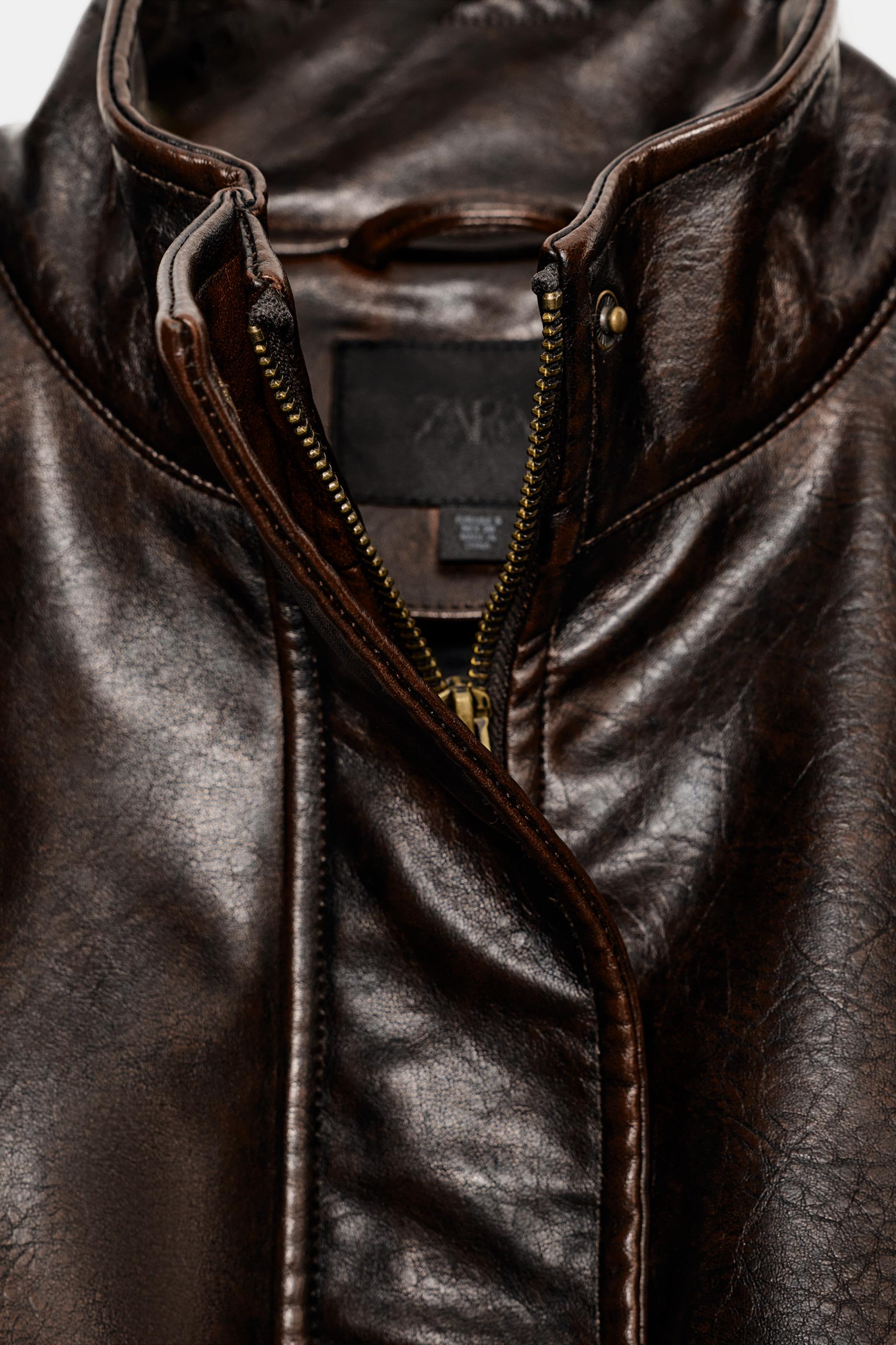 BLOUSON EN MATIÈRE SYNTHÈTIQUE AVEC PATTES